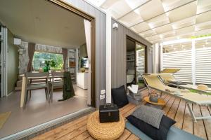 Modern, bright interior, cozy veranda with loungers and elegant details.