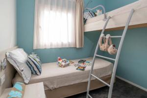 Cozy children's room with bunk beds and colorful toys.