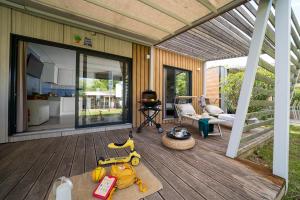 Cozy terrace with toys, barbecue, and relaxation in the sun.