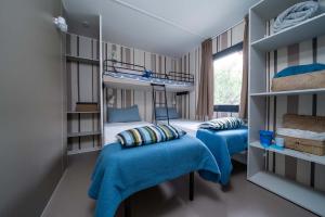Cozy room with bunk beds, vibrant colors, and a relaxing atmosphere.